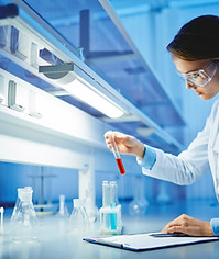 Scientist with Test Tubes