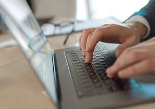 Businessman typing on laptop