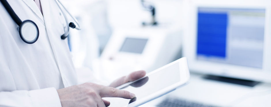 Doctor Using Digital Tablet