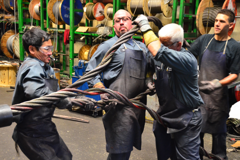 People Folding Metal Wires