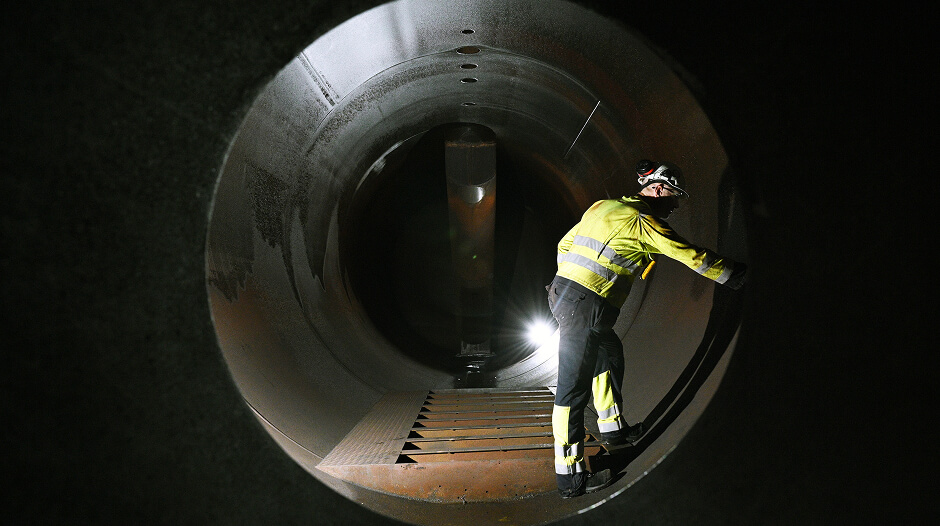 Worker inside of pipe