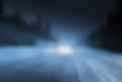 Snowy road by night