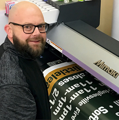 Employee Making a Banner