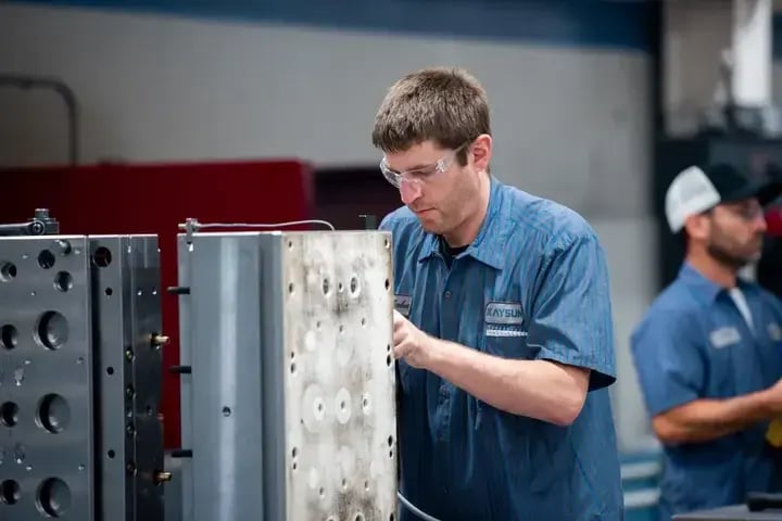 Man Assembling Machine