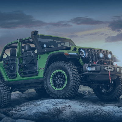 Green Jeep on mountain