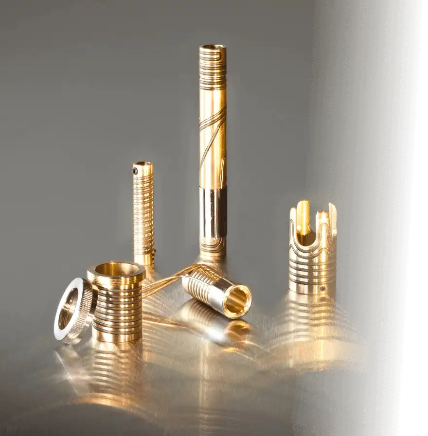 Five cylindrical brass components