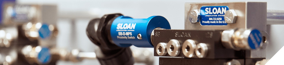Divider block lubrication systems